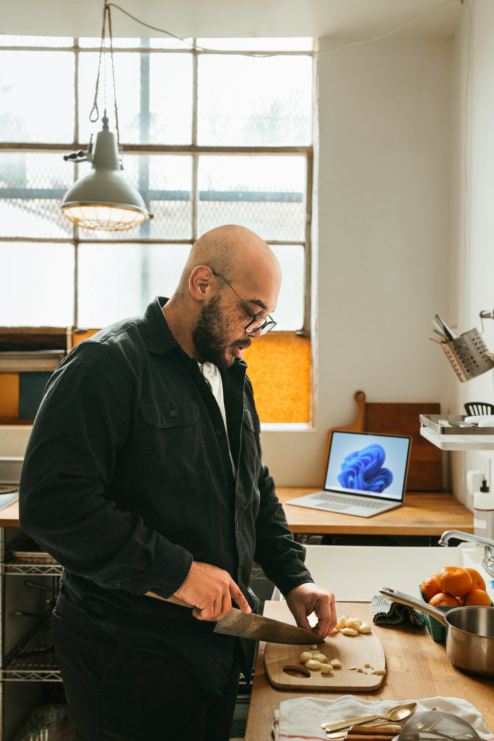 Adult preparing food in a home kitchen