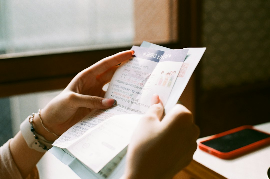 Person reviewing household paperwork