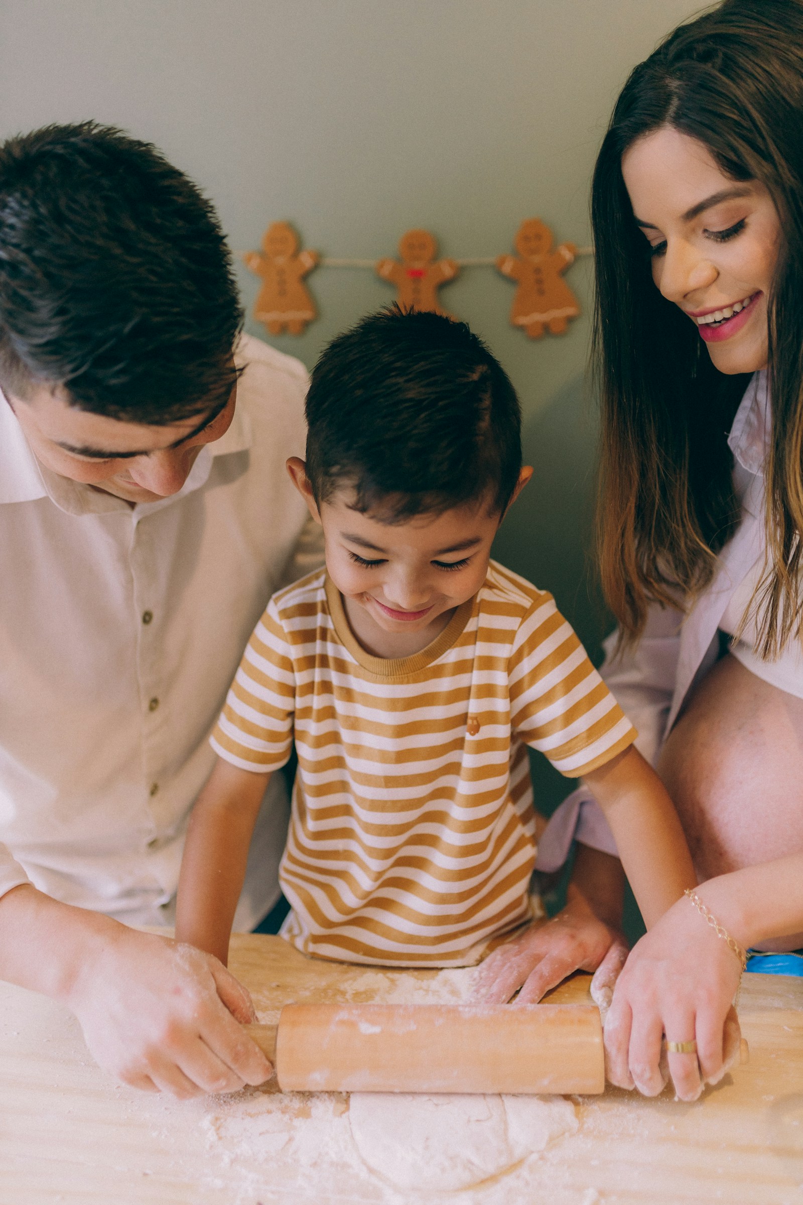 Mother and children spending time together around a kitchen table